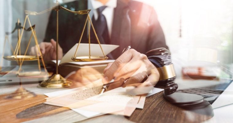 Several Images Exposed Over Each Other: Man in Black Suit, Judges Gavel, Gold Scales and Legal Papers