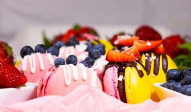 Pink and Yellow Macaroons with Strawberry and Blueberry Topping