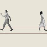 Man and Woman Walk Away in Opposite Direction on Red Arrow