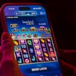 Love Island Unlocked Online Slot Game By FanDuel Casino Displayed on Cell Phone