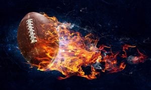 Flaming Football with Fire Resemble Rocket on Black Background