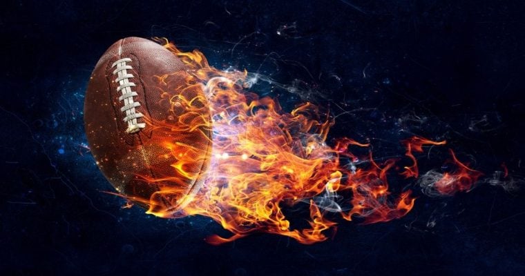 Flaming Football with Fire Resemble Rocket on Black Background