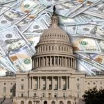 US State Capitol Building in Washington D.C., sits in Front of $100 Banknotes Laying on Flat Surface