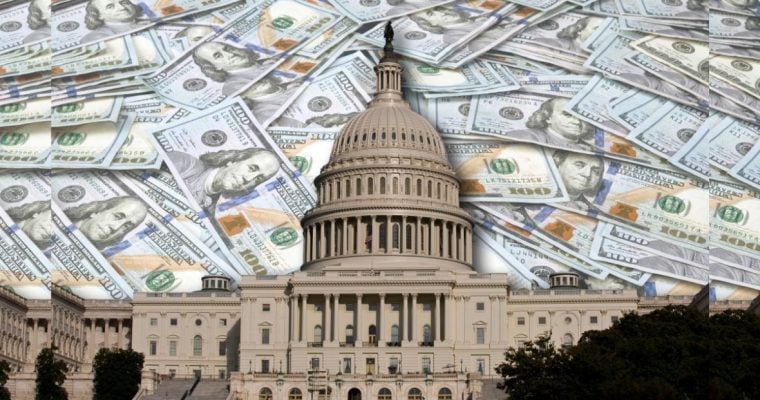 US State Capitol Building in Washington D.C., sits in Front of $100 Banknotes Laying on Flat Surface