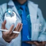 Man in Labcoat Stands Behhind Digital Icons Representing Mental Health and Online Support Services