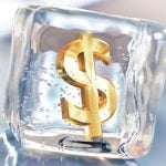 Block of Ice with Golden Dollar Symbol inside Represents Frozen Money