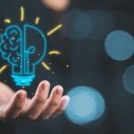 Lightbulb Brain Digital Illustration Floating in Man's Hand Represents Good Ideas