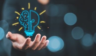Lightbulb Brain Digital Illustration Floating in Man's Hand Represents Good Ideas