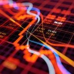 Colorful Lines on Red Grid Represent Financial Chart