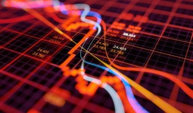Colorful Lines on Red Grid Represent Financial Chart