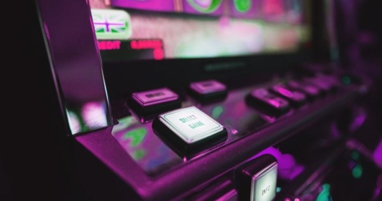 The Michigan Gaming Control Board says it seized three suspected illegal slot-style machines, gift cards, and cash from a Muskegon bar.