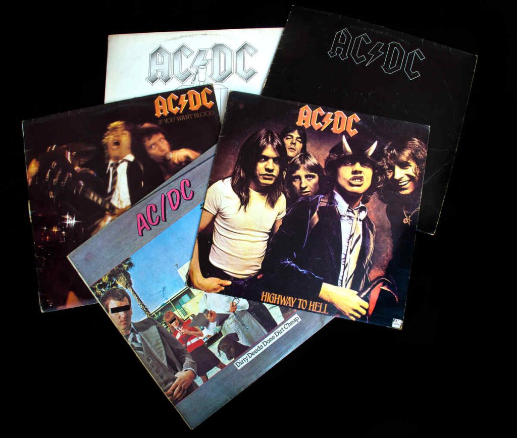 collection of old vinyl records of rock group AC DC