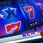 Laptop with Online Slot Reel Featuring Blue Stars and Red 7's