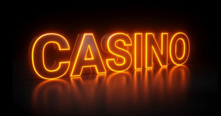 Bright Orange Neon Sign on Black Background Reads 