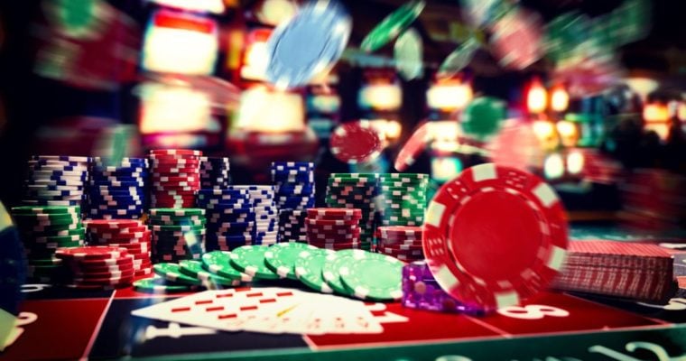 Flying Poker Chips and Stacks On Top of Casino Game Table