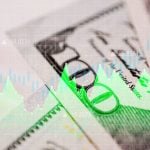 Electric Green Line Graph Overlay on $100 American Banknotes