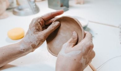Clay Workshop With Woman Making Small Ceramic Plate