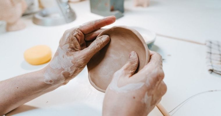 Clay Workshop With Woman Making Small Ceramic Plate