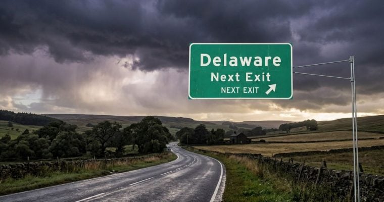 Storm Clouds and Delaware Exit Sign Over Country Road