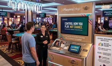 Casino Guest Speaks with Hard Rock Employee on Responsible Gambling Tools on Casino Floor