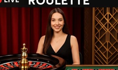 Young Woman as Live Online Casino Dealer Sits Behind Roulette Wheel