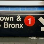 Subway Sign in NYC Reads Uptown & The Bronx with 1 in Red Circle