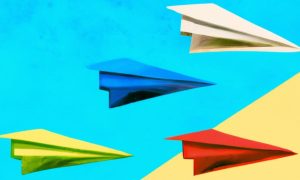 Illustration of Hand-Painted Paper Airplanes on Colorblocked Background