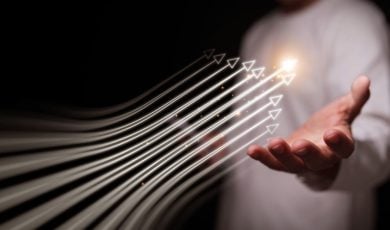 Several White Arrows Move Upward Hovering Over Man's Hand