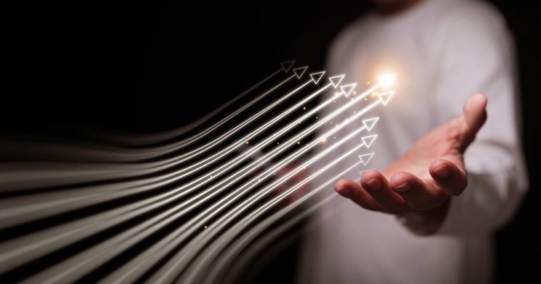 Several White Arrows Move Upward Hovering Over Man's Hand