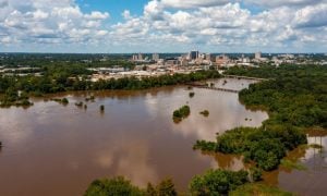 Flooded Brown Pearl River with Jackson, Mississippi Cityscape in the Background