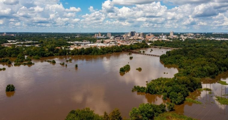 Flooded Brown Pearl River with Jackson, Mississippi Cityscape in the Background