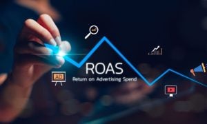 Hand Draws Rising Blue Line with Icons Related to Marketing and ROAS Text
