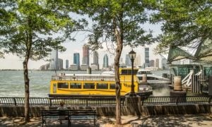 Yellow Water Taxi Sits in Hudson River at Battery Park in NYC
