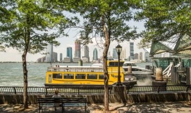 Yellow Water Taxi Sits in Hudson River at Battery Park in NYC