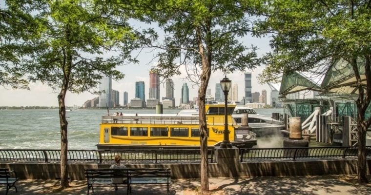 Yellow Water Taxi Sits in Hudson River at Battery Park in NYC